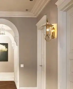 Gold brass outdoor wall sconce with clear glass shade N-Lighten